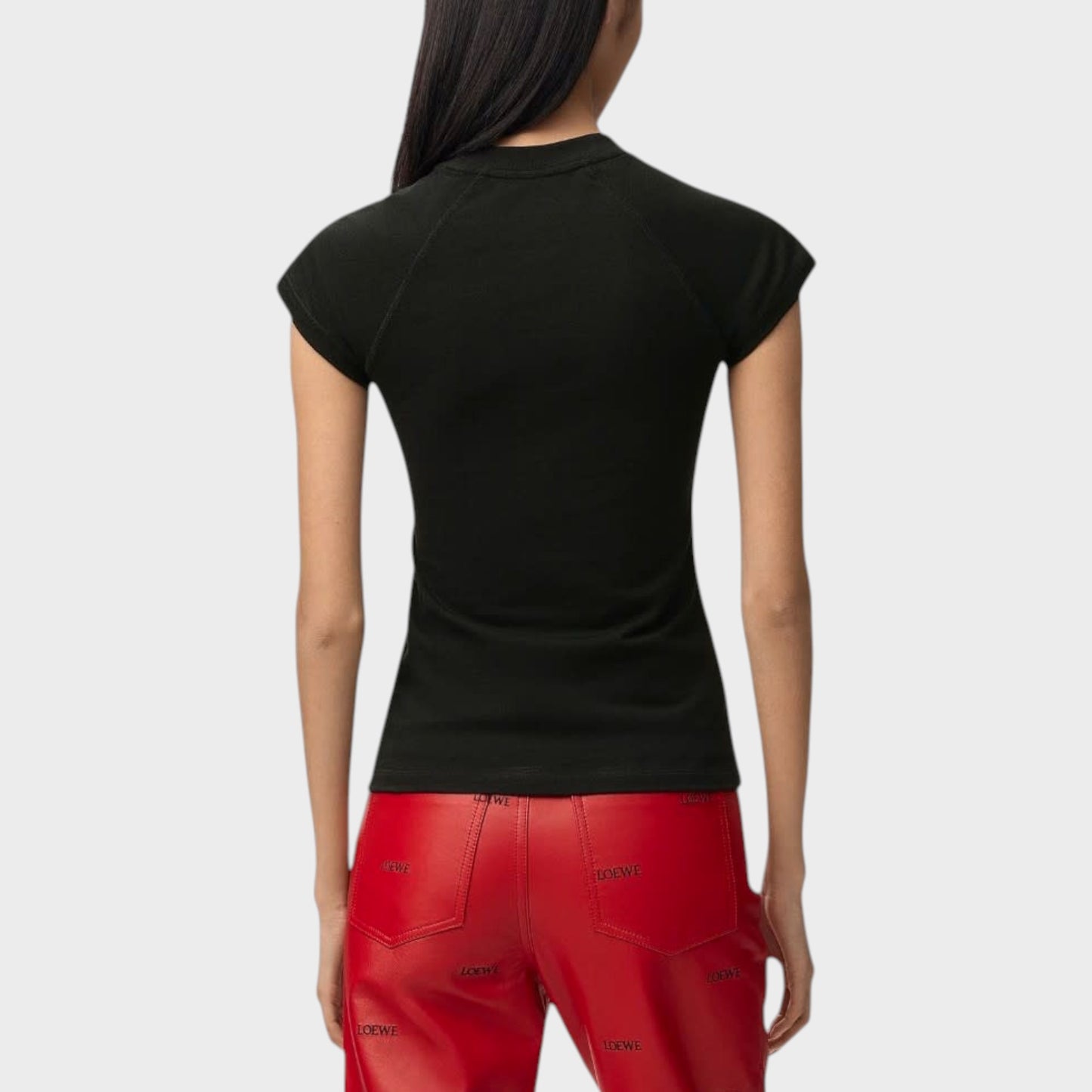 Tasoni black short-sleeve t-shirt with mock neck, worn by a woman.