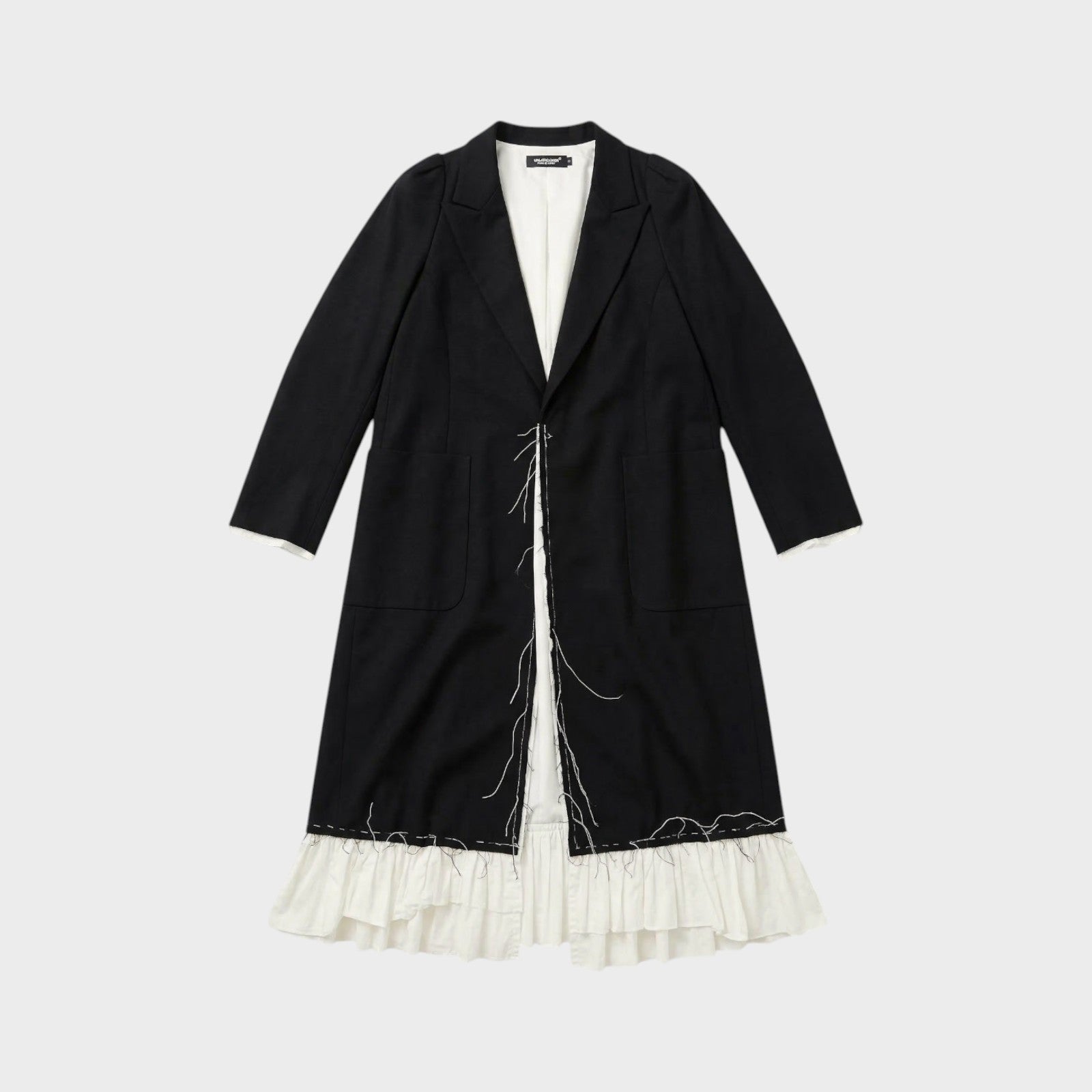 Tasoni black long coat with white ruffled lining and raw edge detail. Features a classic lapel and two front pockets.