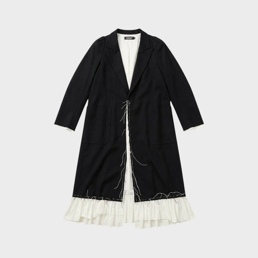 Tasoni black long coat with white ruffled lining and raw edge detail. Features a classic lapel and two front pockets.