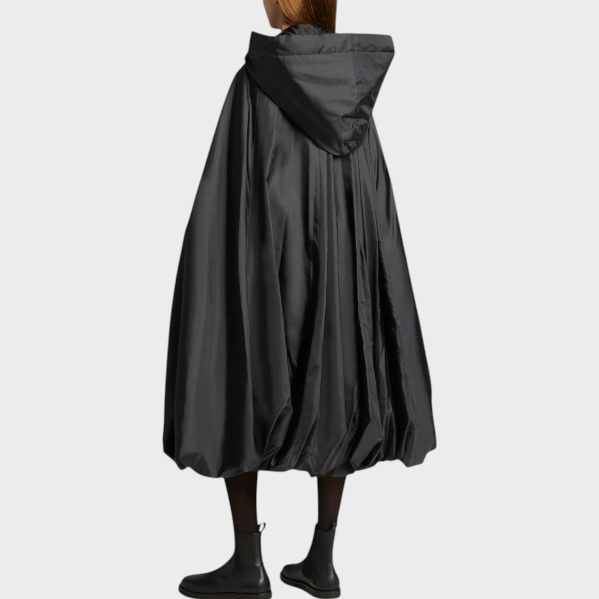 Tasoni black satin quilted tie fastening hood sleeveless jacket with voluminous skirt and balloon hem.
