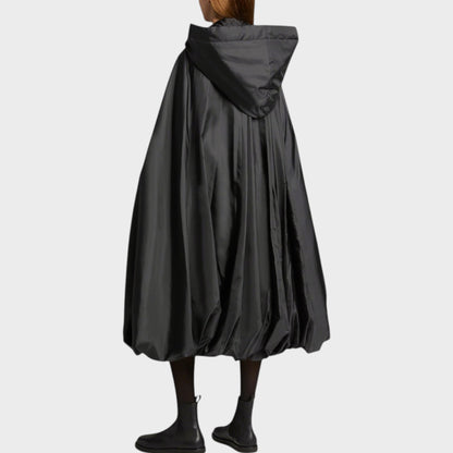 Tasoni black satin quilted tie fastening hood sleeveless jacket with voluminous skirt and balloon hem.