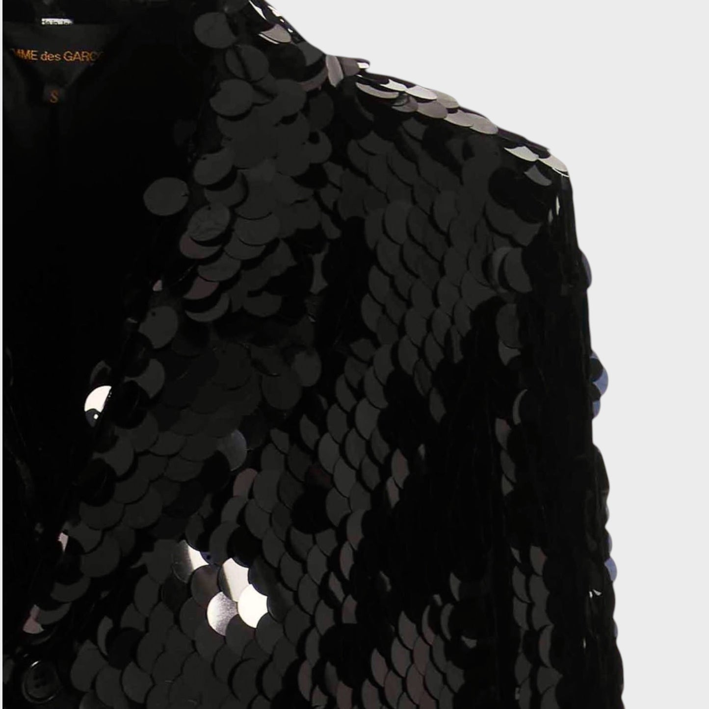 Tasoni black sequin asymmetric coat with velvet trim and a structured shoulder.
