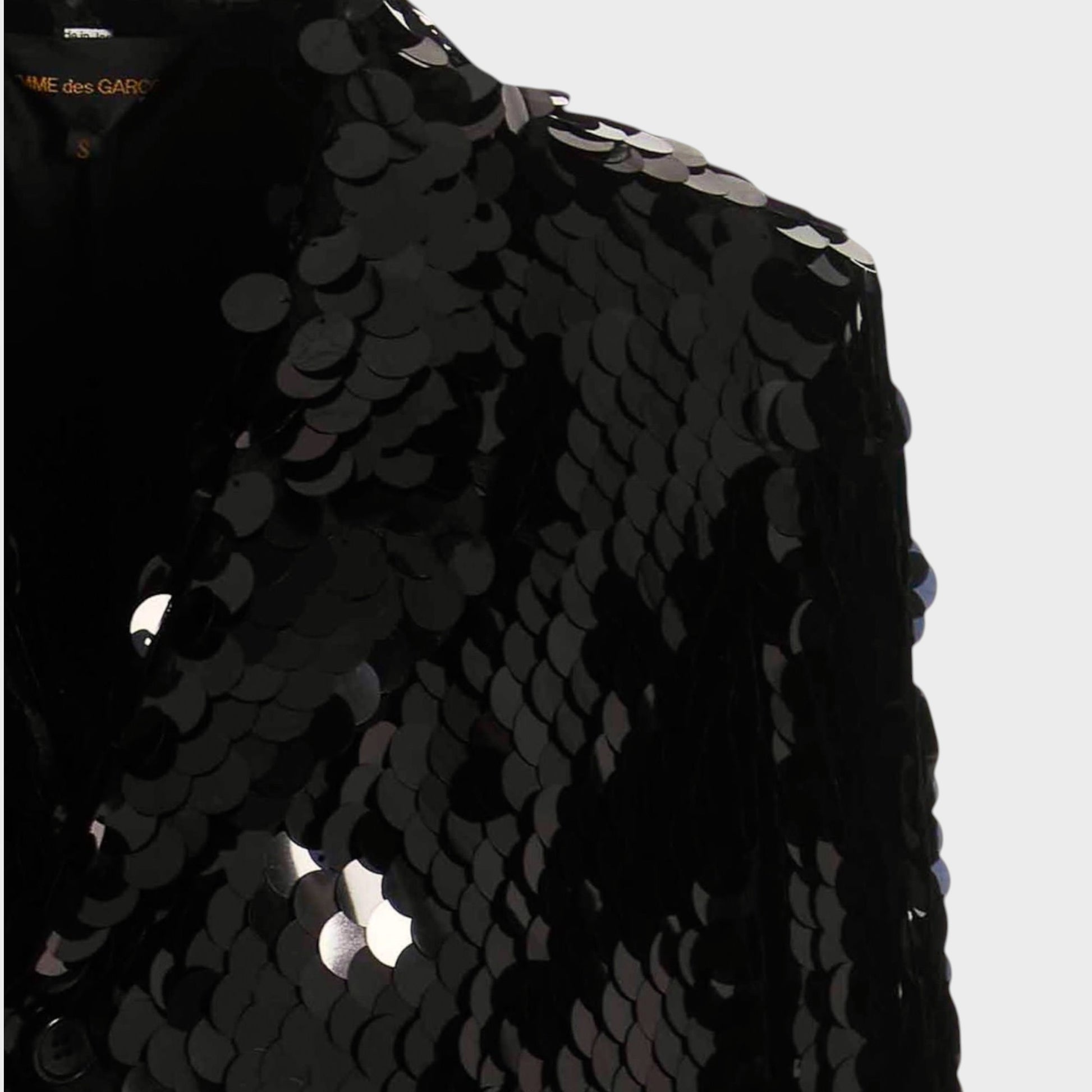 Tasoni black sequin asymmetric coat with velvet trim and a structured shoulder.
