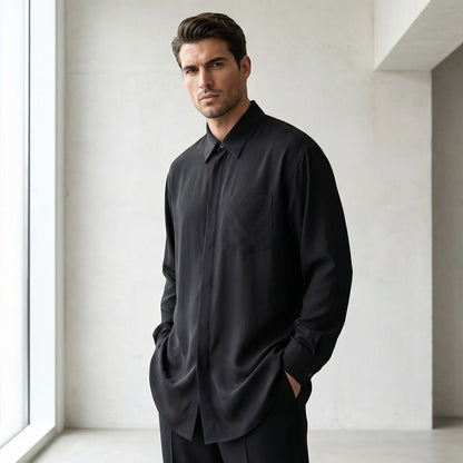 Tasoni classic black silk long-sleeve shirt with a single chest pocket, worn by a male model.