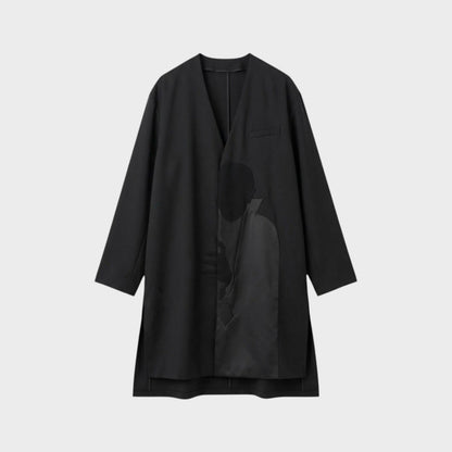 Tasoni black wool asymmetric collarless coat with a subtle Dracula motive print on the front.
