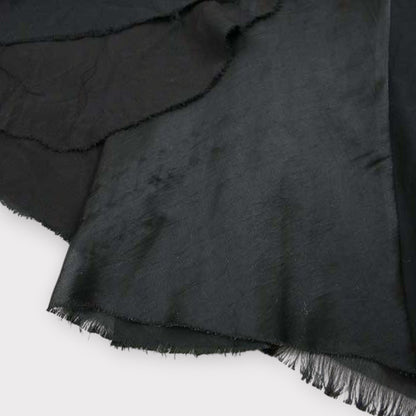 Tasoni black wool panel layered A-line maxi skirt with raw hem detail.