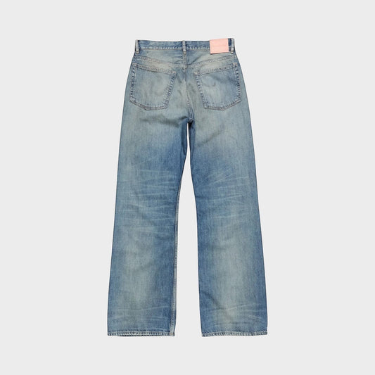 Tasoni mid blue cotton mid waist flare leg denim jeans with pink logo patch.