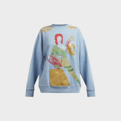 Tasoni light blue cotton crewneck sweatshirt with a graphic print of David Bowie in a gold and green outfit, gold accents on shoulders.