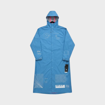 Tasoni sky blue hooded rain parka with graphic print details and pink lining.