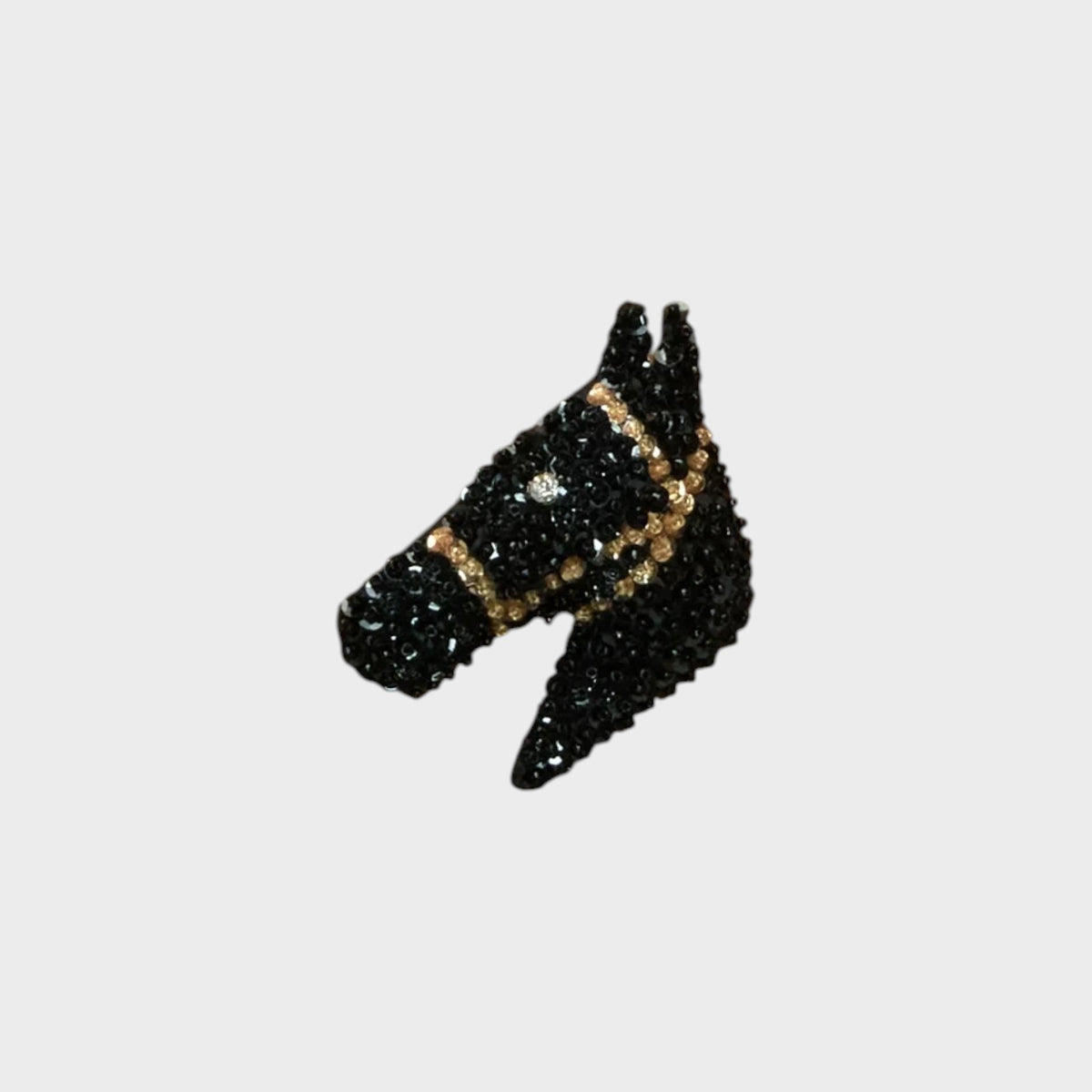 Tasoni Bode black sequin pony barrette with gold-tone bridle detail and secure metal clasp for hair styling.