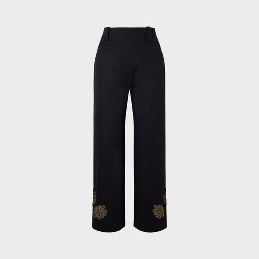 Tasoni Bode high-waisted black trousers with straight legs and gold embroidered floral detail on the cuffs.