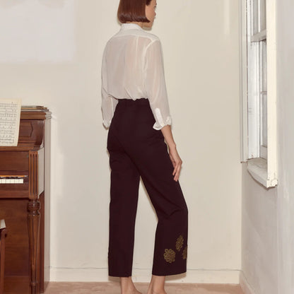 Tasoni Bode black high-waisted straight-leg trousers with looped frog embroidery on the hem.
