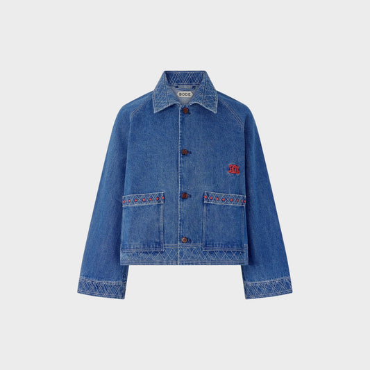 Tasoni Bode embroidered denim jacket in indigo blue with geometric pattern and red accents.