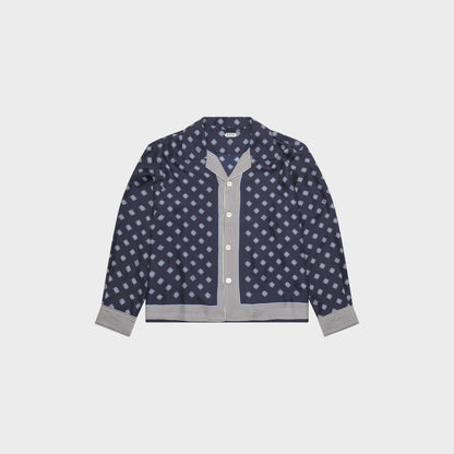 Tasoni Bode long sleeve shirt in navy blue with a diamond pattern and striped trim. Features a camp collar and button front.