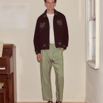 Tasoni Bode Lucky Draw Embroidered Jacket in dark brown with green and red clover embroidery. Features a zip front and classic collar.