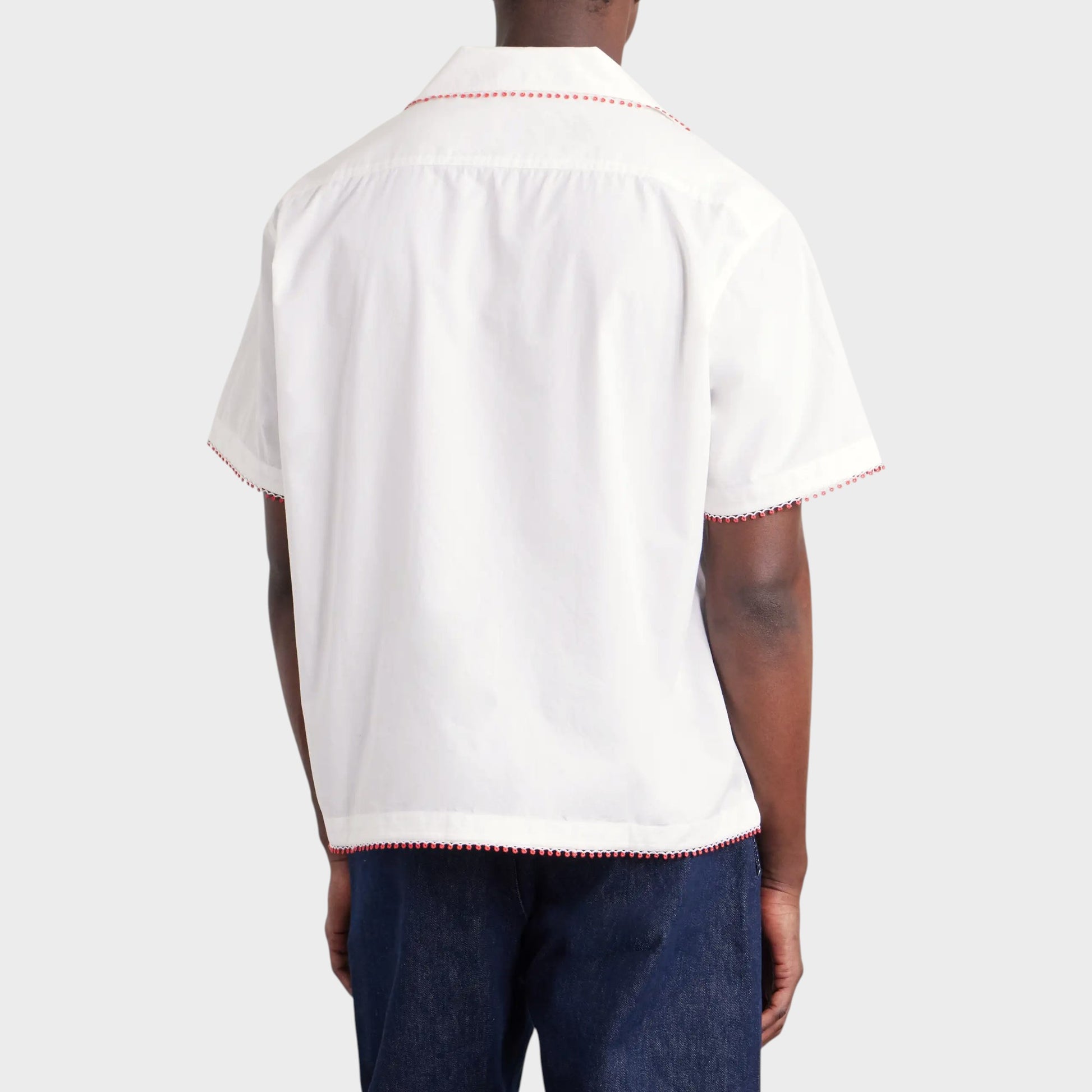 Tasoni Bode Redbud Shirt: white cotton short-sleeve shirt with red trim detail on collar and hem.