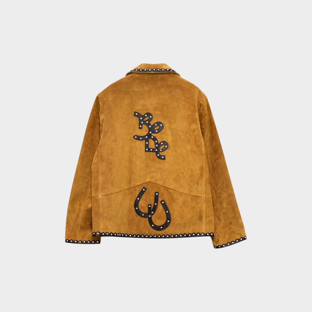 Back view of Tasoni Bode tan brown suede Carson jacket featuring black leather horseshoe and logo appliqués with studs.