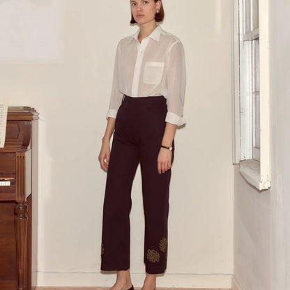 Tasoni Bode Trousers, black, high-waisted, straight-leg trousers with embroidered floral detail at the hem.
