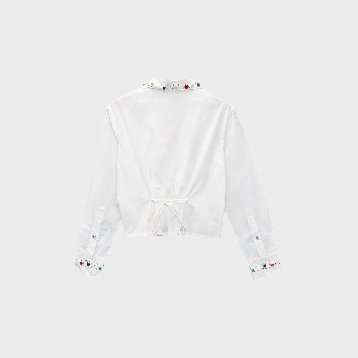 Tasoni Bode white cotton voile shirt with multi-colored vintage button embellishments on collar and cuffs, back view.