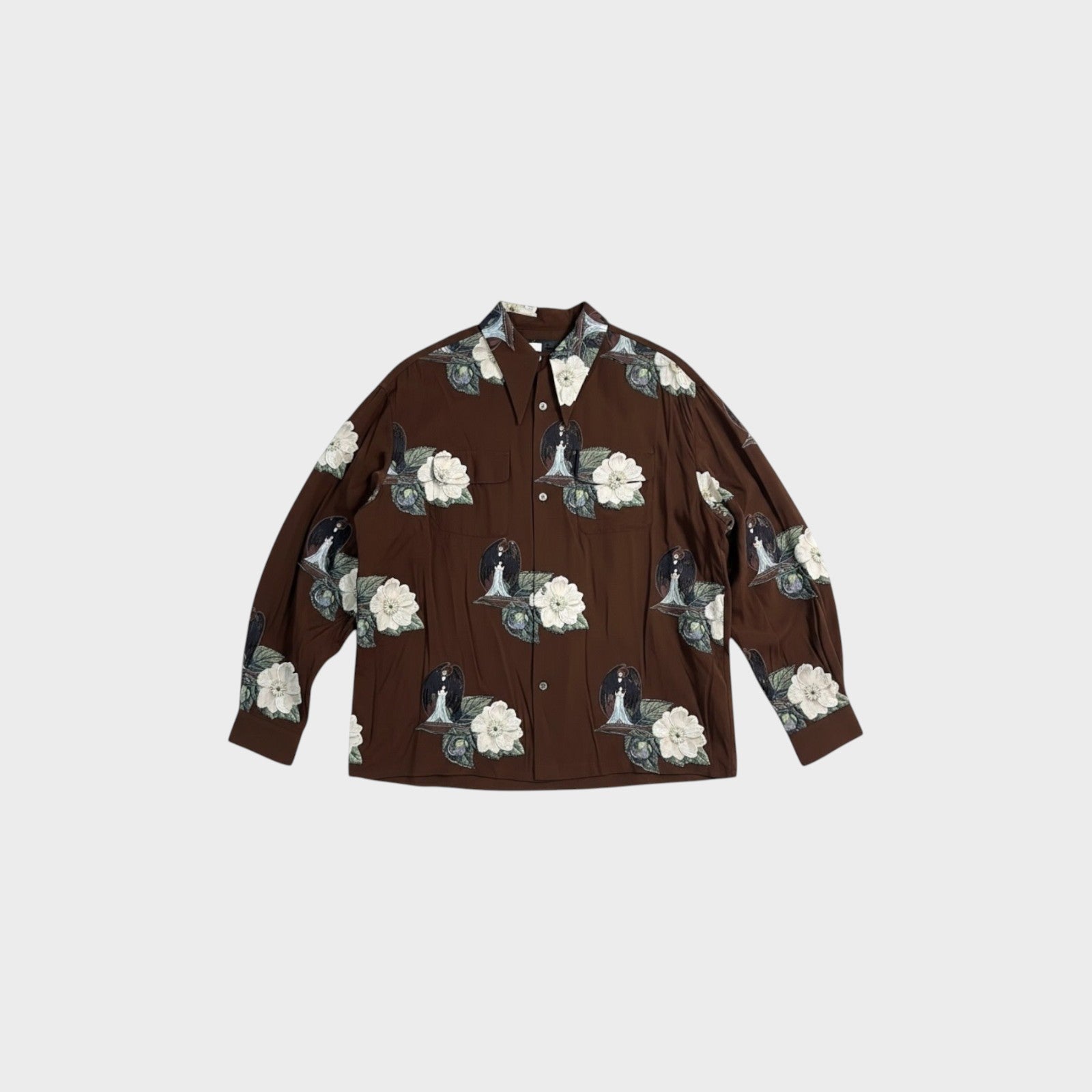 Tasoni brown long-sleeve shirt with all-over print of white flowers and figures.