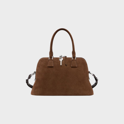 Tasoni brown suede leather medium 5AC bag with top handles and a detachable strap, featuring a signature key charm.