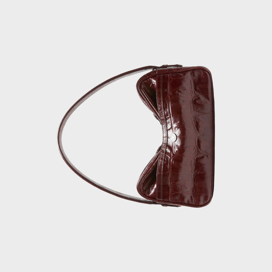 Tasoni burgundy patent leather shoulder bag with crocodile embossed finish and silver clasp.