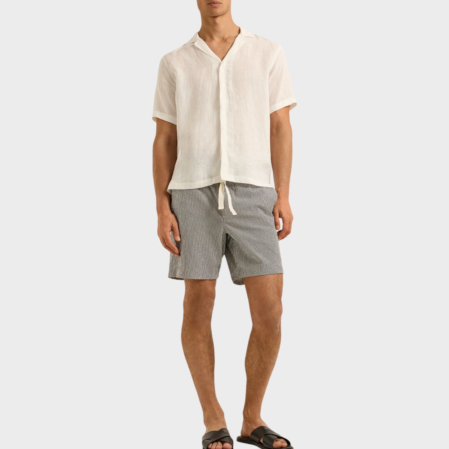 Tasoni men's charcoal and white stripe print drawcord swim trunks made from quick-drying fabric.