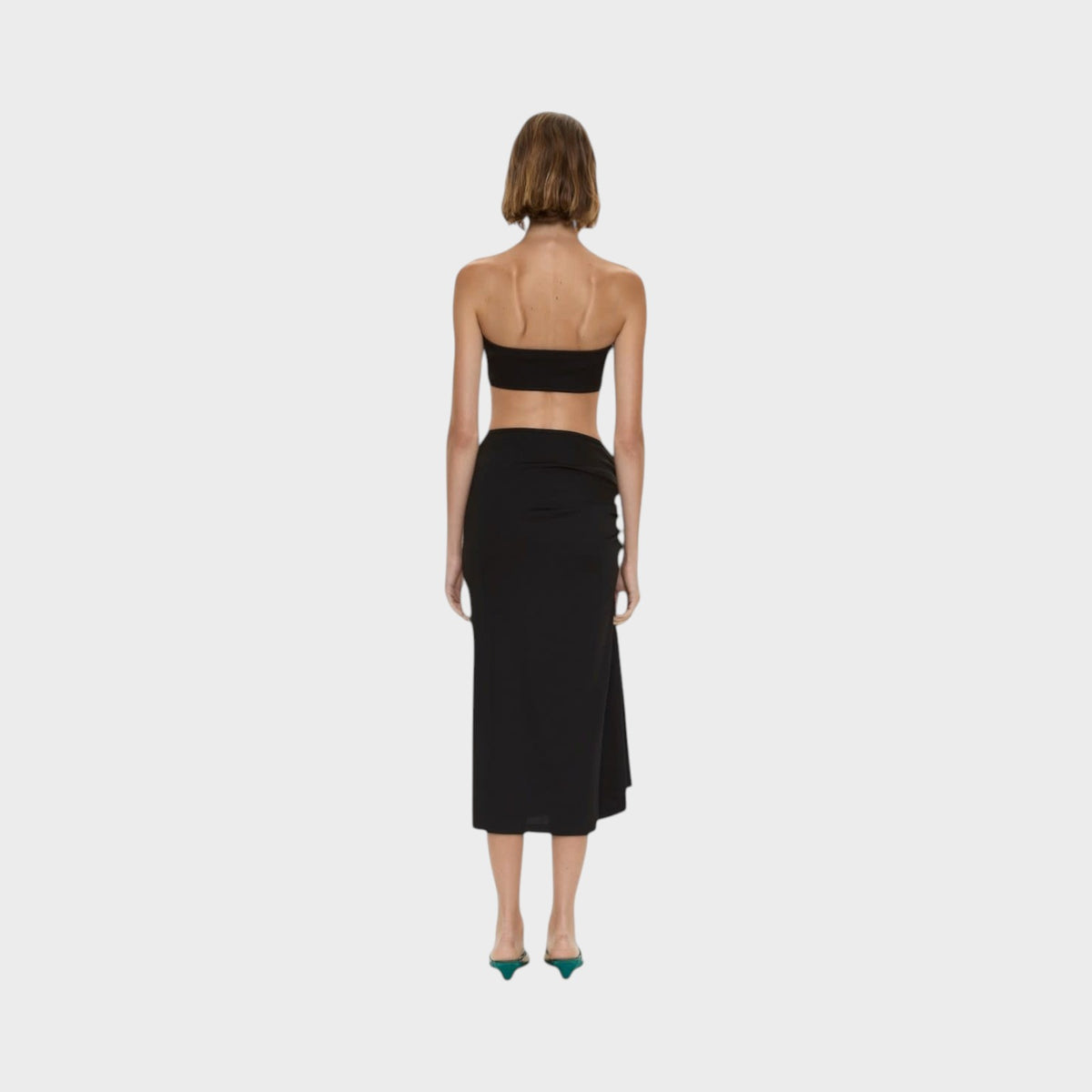 Tasoni Christopher Esber black compact ribbed midi skirt featuring a side droplet crystal clasp, back view.