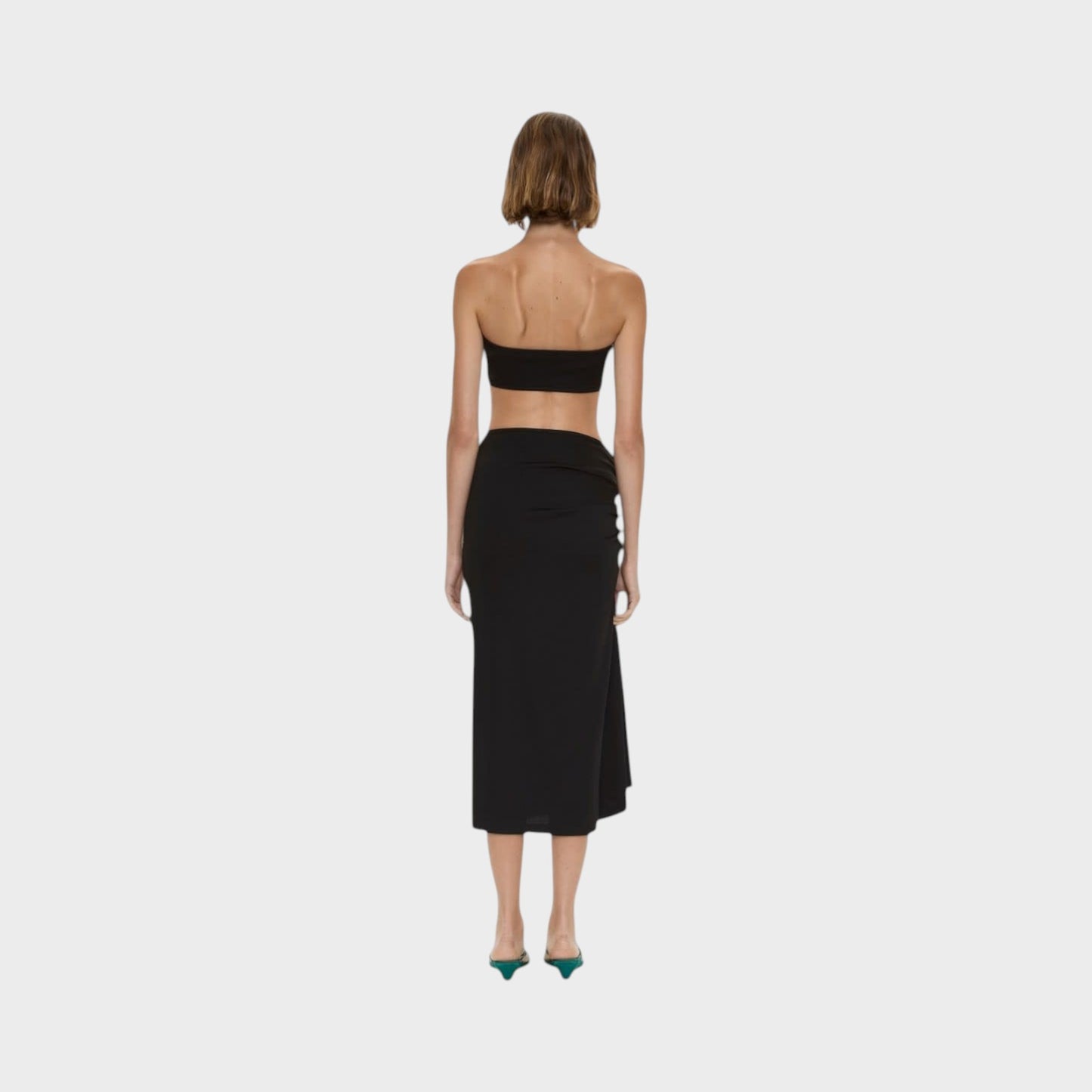 Tasoni Christopher Esber black compact ribbed midi skirt featuring a side droplet crystal clasp, back view.