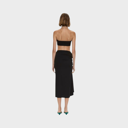 Tasoni Christopher Esber black compact ribbed midi skirt featuring a side droplet crystal clasp, back view.