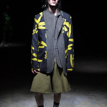 Tasoni Comme des Garcons Homme Plus black wool mix jacket with yellow floral print and grey pinstripe overlay.