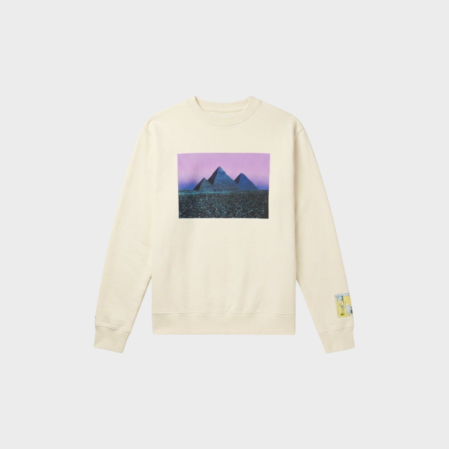 Tasoni cream cotton crew neck sweatshirt with a graphic print of pyramids under a purple sky.
