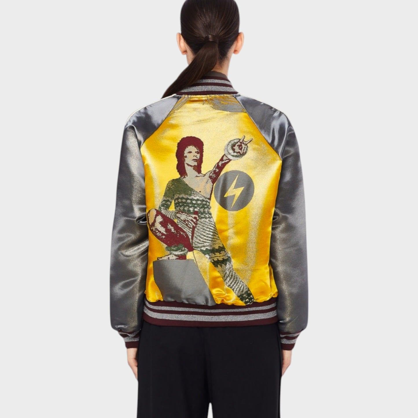 Tasoni multi-colored satin bomber jacket with David Bowie graphic print on back, standing collar, and striped cuffs.