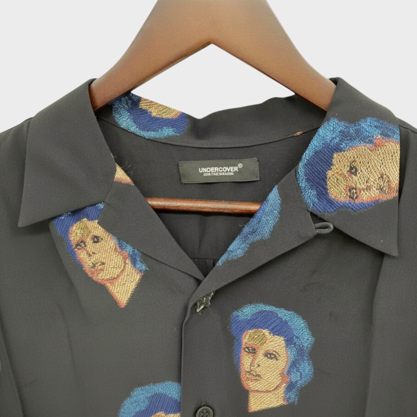 Tasoni black silk blend short sleeve shirt with a repeating David Bowie portrait print on the collar and chest.