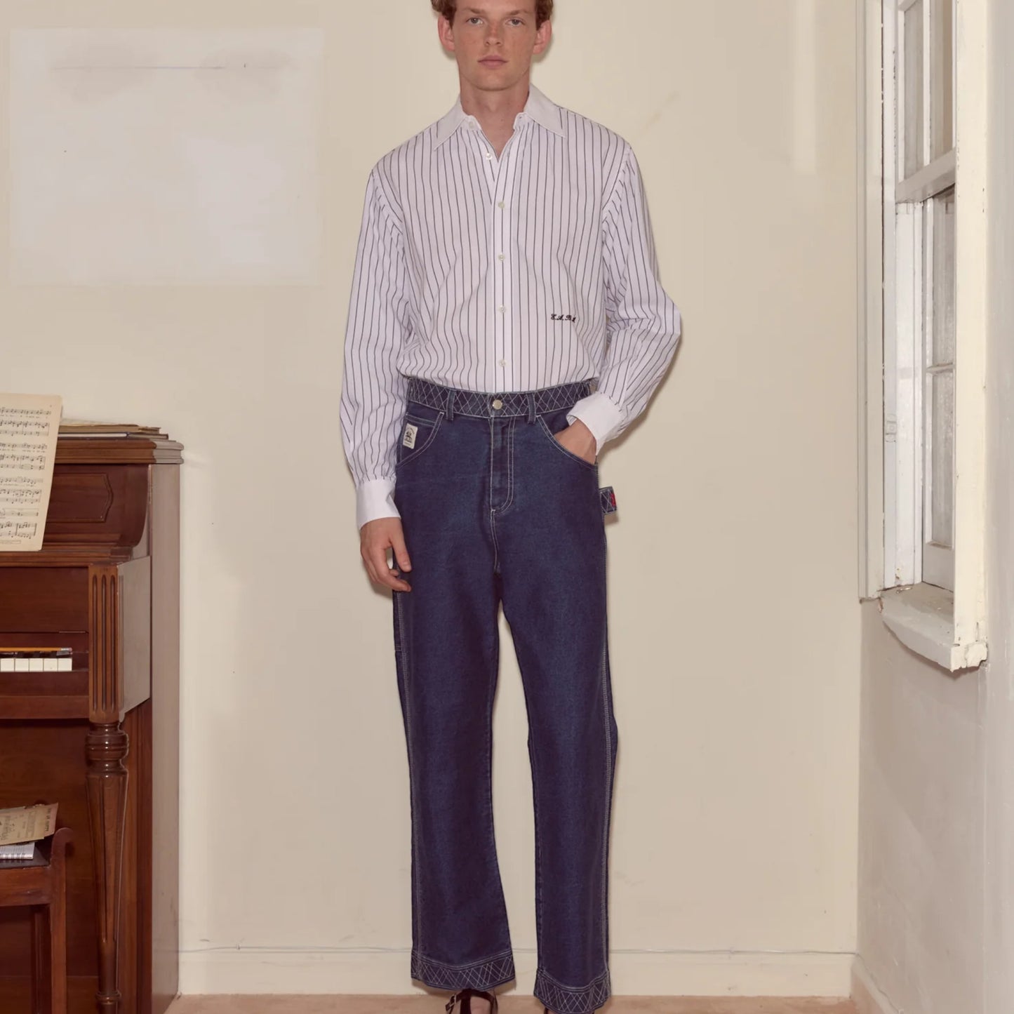Tasoni indigo denim pants with embroidered detailing, relaxed straight-leg fit, and classic five-pocket styling.