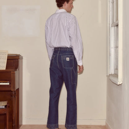 Tasoni indigo denim pants with embroidered detailing and a relaxed straight-leg silhouette.