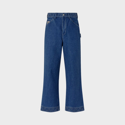 Tasoni indigo denim pants with embroidered detailing on waistband and cuffs, relaxed straight-leg fit.