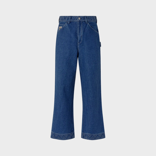 Tasoni indigo denim pants with embroidered detailing on waistband and cuffs, relaxed straight-leg fit.