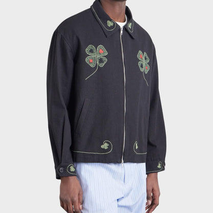 Tasoni black embroidered jacket with lucky draw clover motif on collar and chest, featuring green and red stitching.