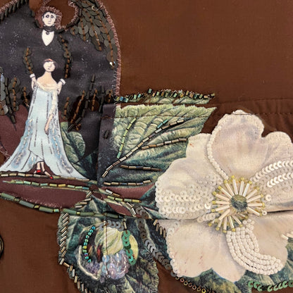 Tasoni brown silk shirt with intricate embroidery featuring a woman in a blue gown, a winged figure, and a white floral design with beads and sequins.