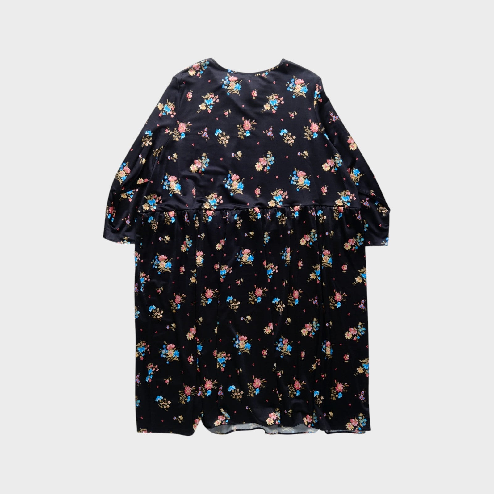 Tasoni black long sleeve crew neck dress with a colorful floral print and tiered skirt.