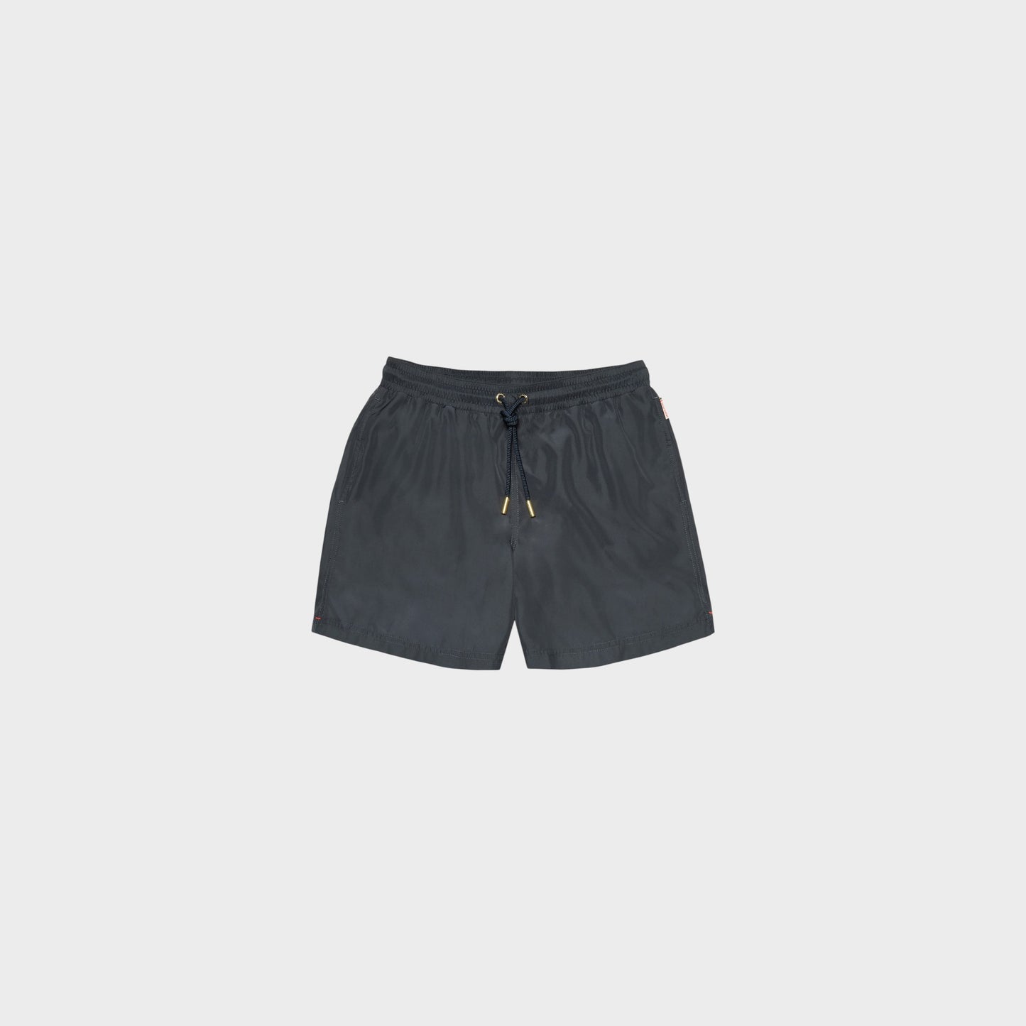 Tasoni Orlebar Brown Boxer III swim trunks in granite grey, featuring a drawstring waist with gold hardware and side pockets.