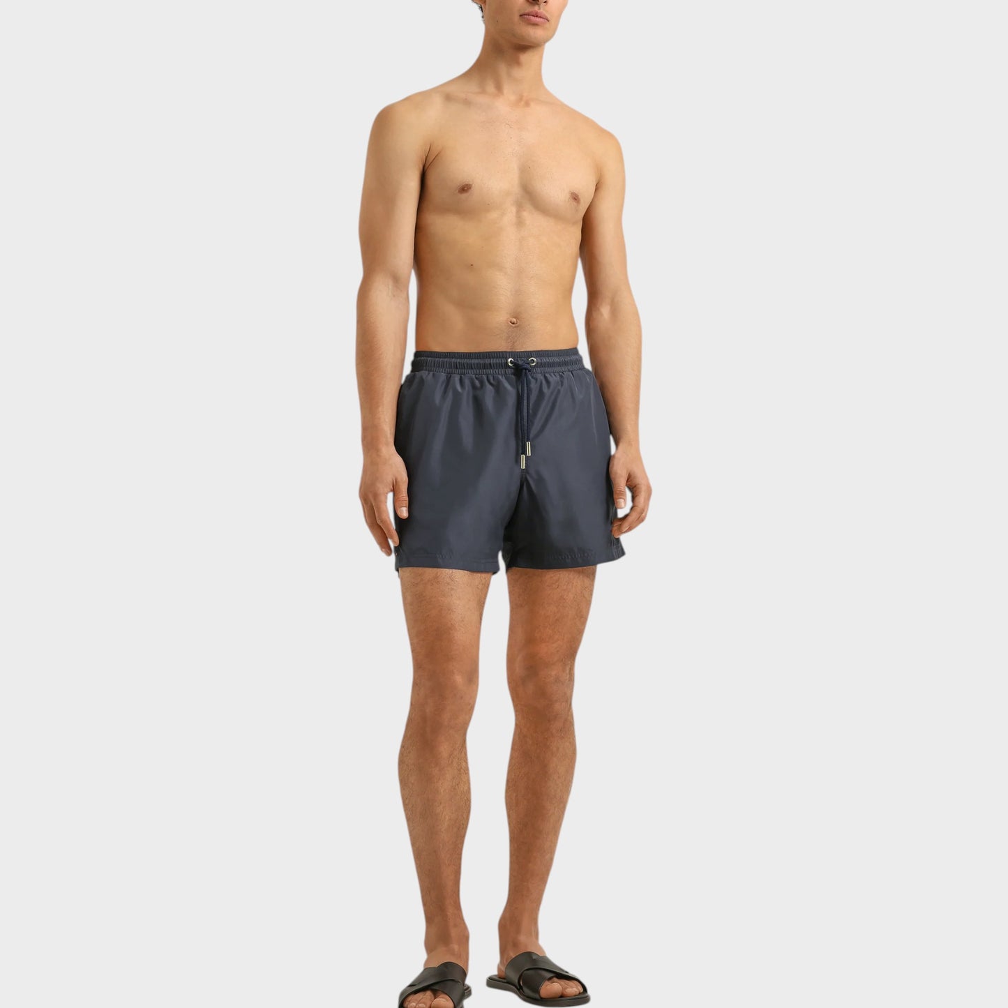 Tasoni men's granite grey boxer III drawcord swim trunks with elastic waistband and adjustable tie. Model is wearing black slides.