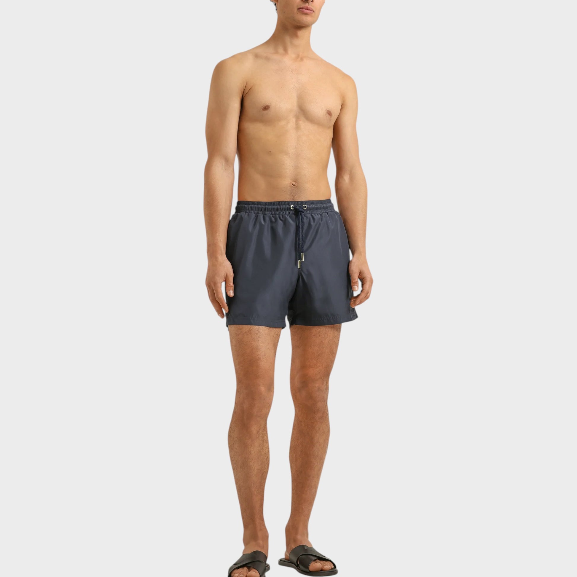 Tasoni men's granite grey boxer III drawcord swim trunks with elastic waistband and adjustable tie. Model is wearing black slides.