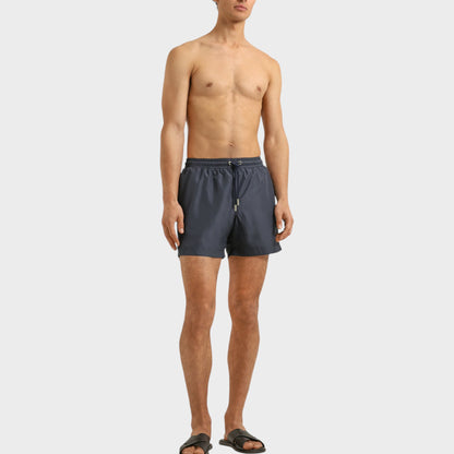 Tasoni men's granite grey boxer III drawcord swim trunks with elastic waistband and adjustable tie. Model is wearing black slides.