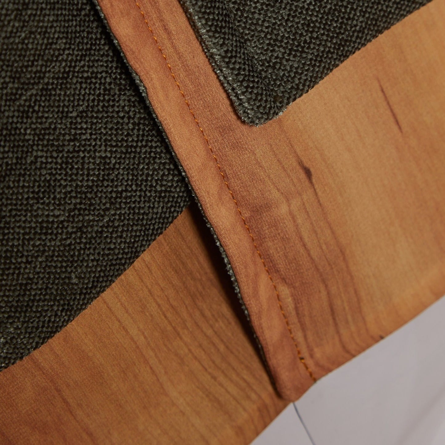 Tasoni green textured coat with wood-grain print panel and contrast stitching.