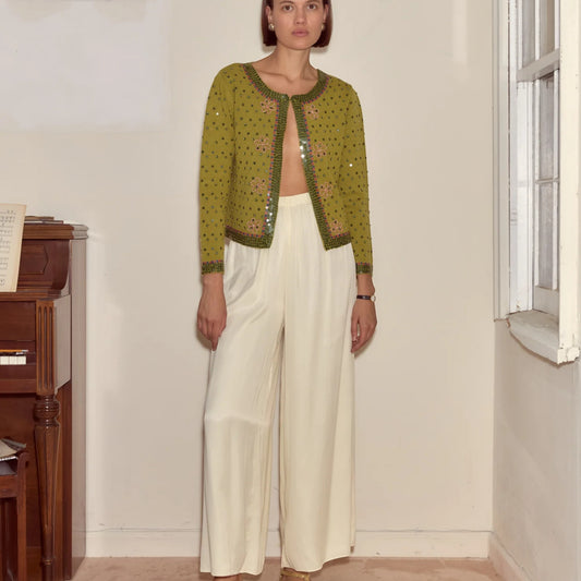 Tasoni green knit cardigan with fairy floss sequins and crew neck. Features floral embellishments and a buttonless front.