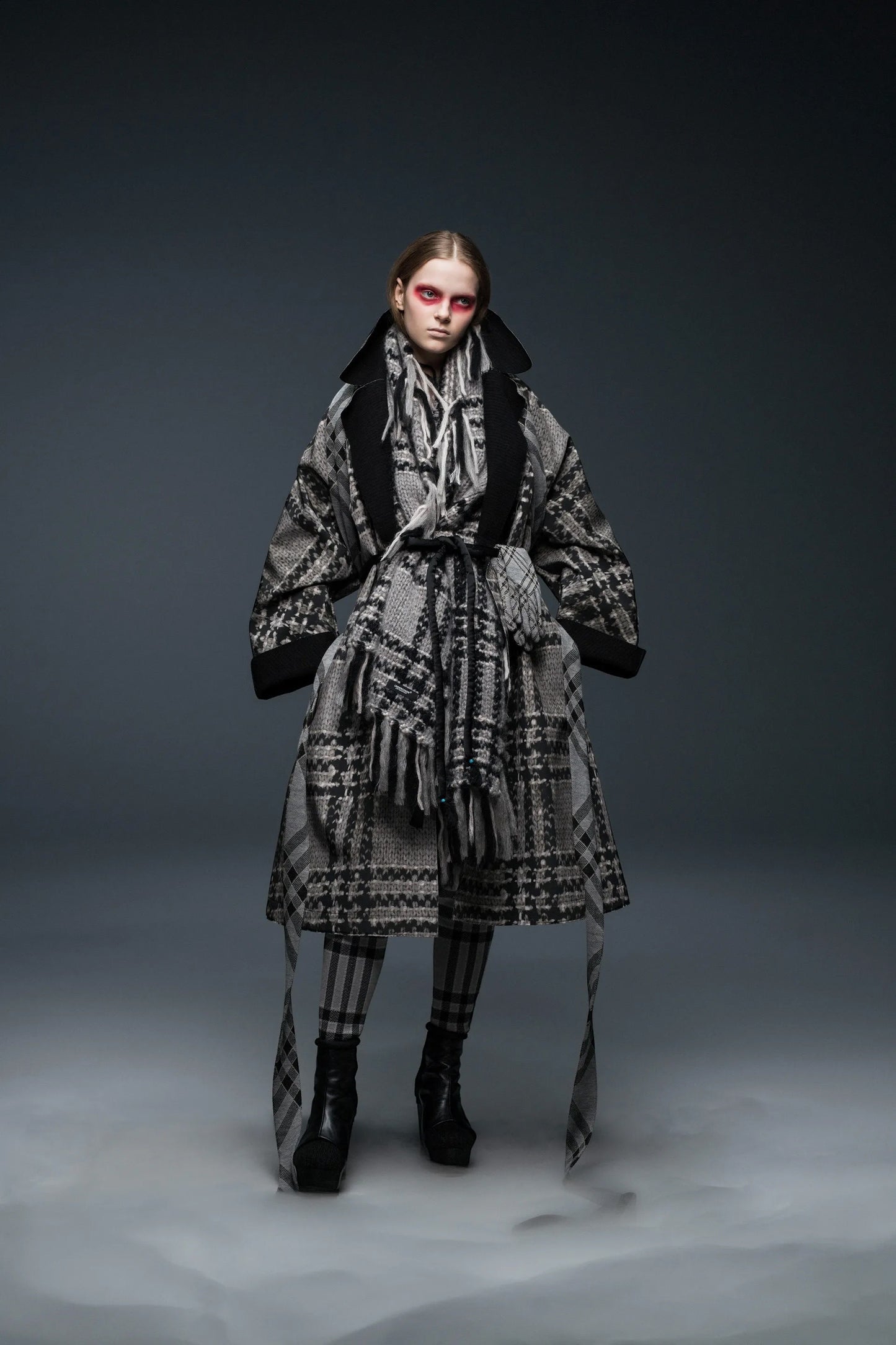 Tasoni grey and black oversized kimono coat with knit print, fringe scarf, and matching plaid leggings.