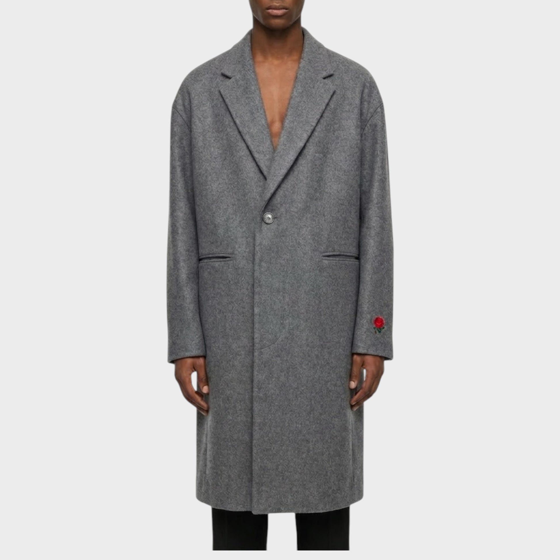 Tasoni charcoal grey wool and cashmere blend coat with rose embroidery on the sleeve. Men's long coat with classic lapels and single button closure.