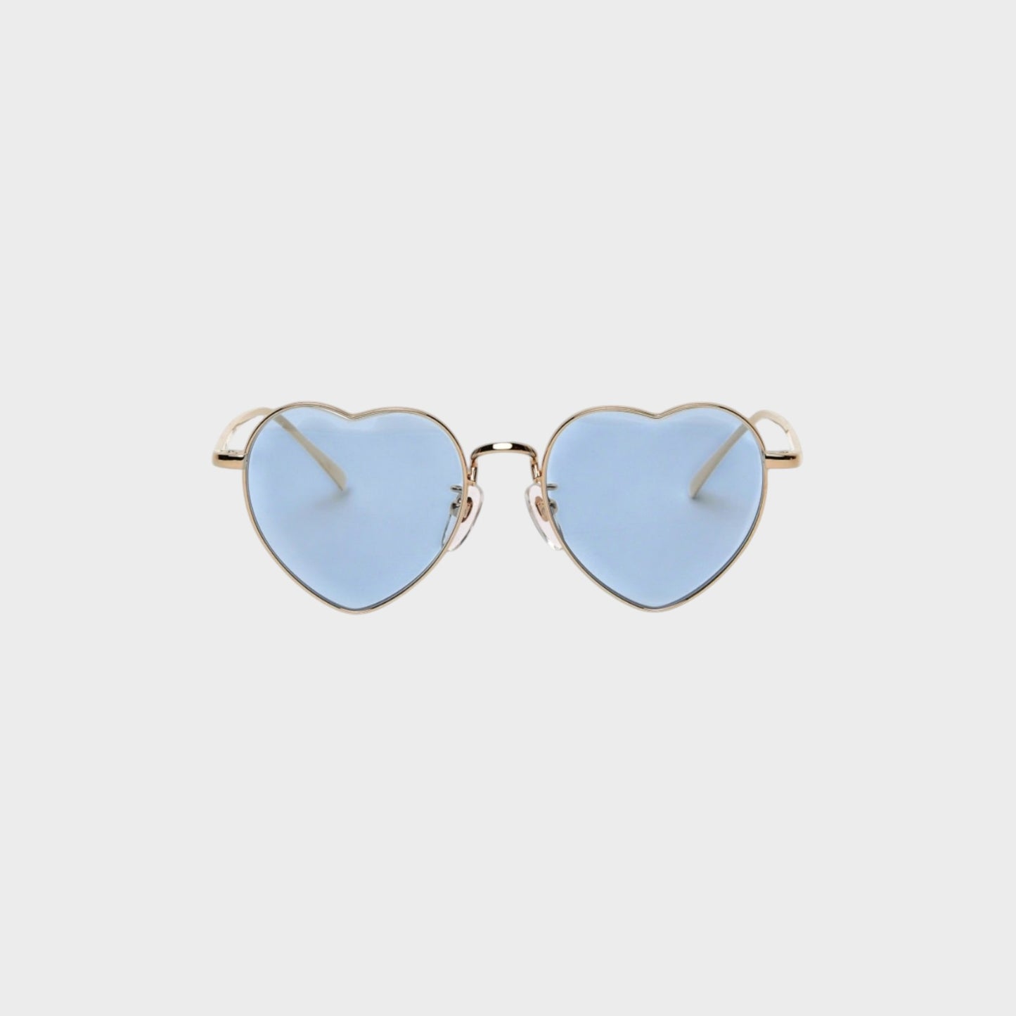 Tasoni heart-shaped sunglasses with gold frames and light blue lenses.